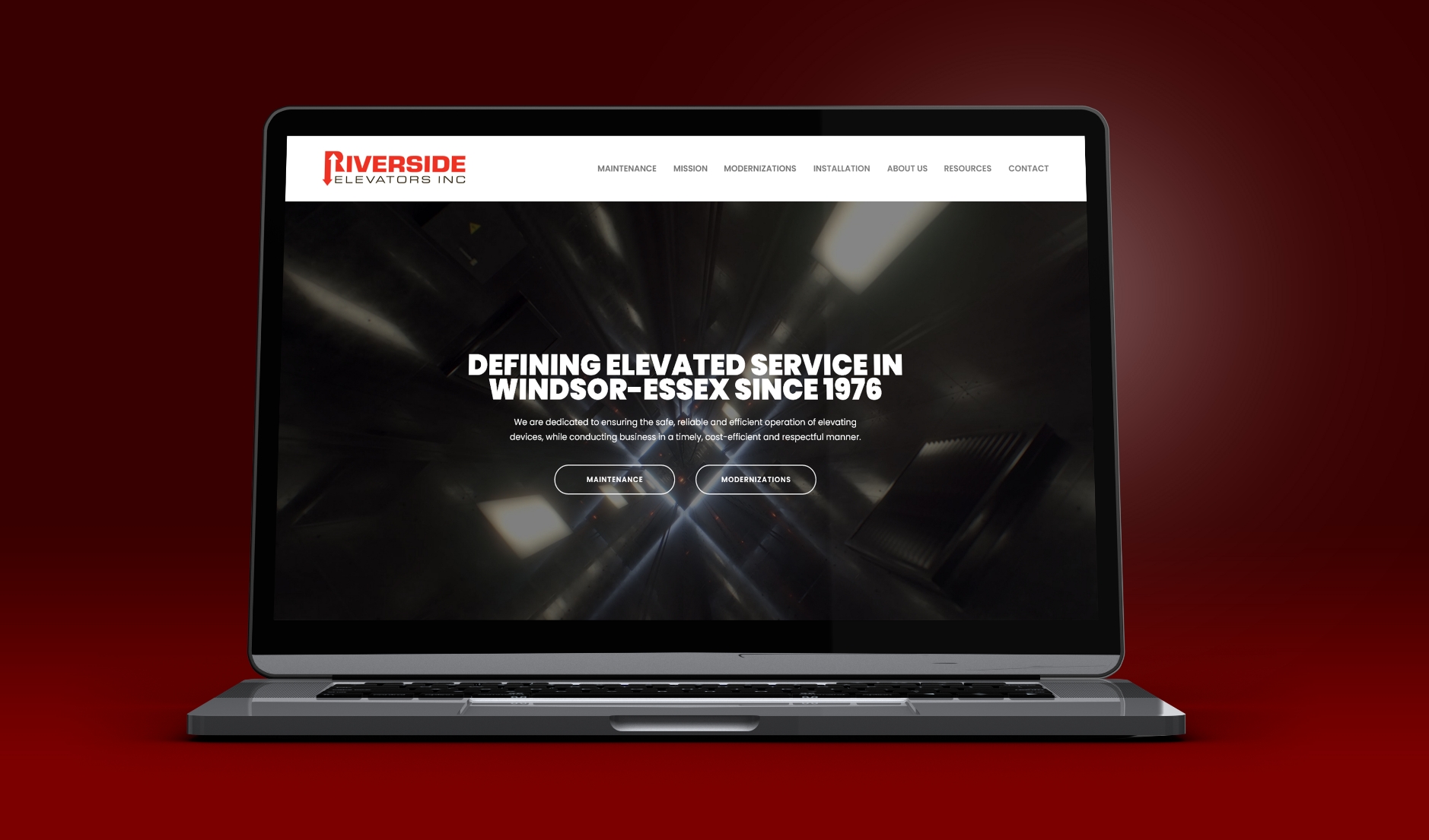 Riverside Elevators homepage displayed on a laptop screen